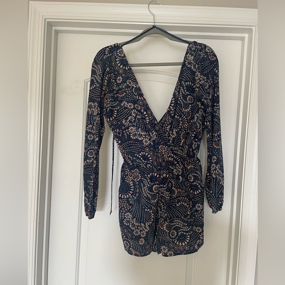 Floral long sleeve romper. Size medium.
